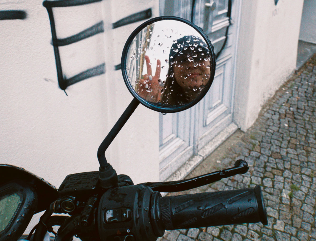 Moped mirror peace sign